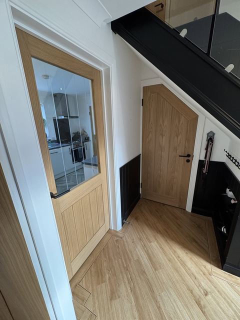 Hallway with oak glazed door and oak under-stair door