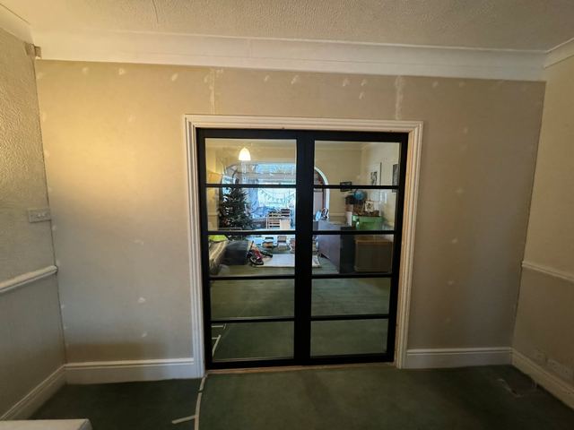 Black-framed glazed double doors
