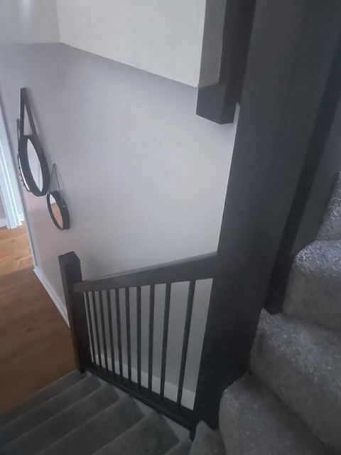 Staircase with black spindles and handrail
